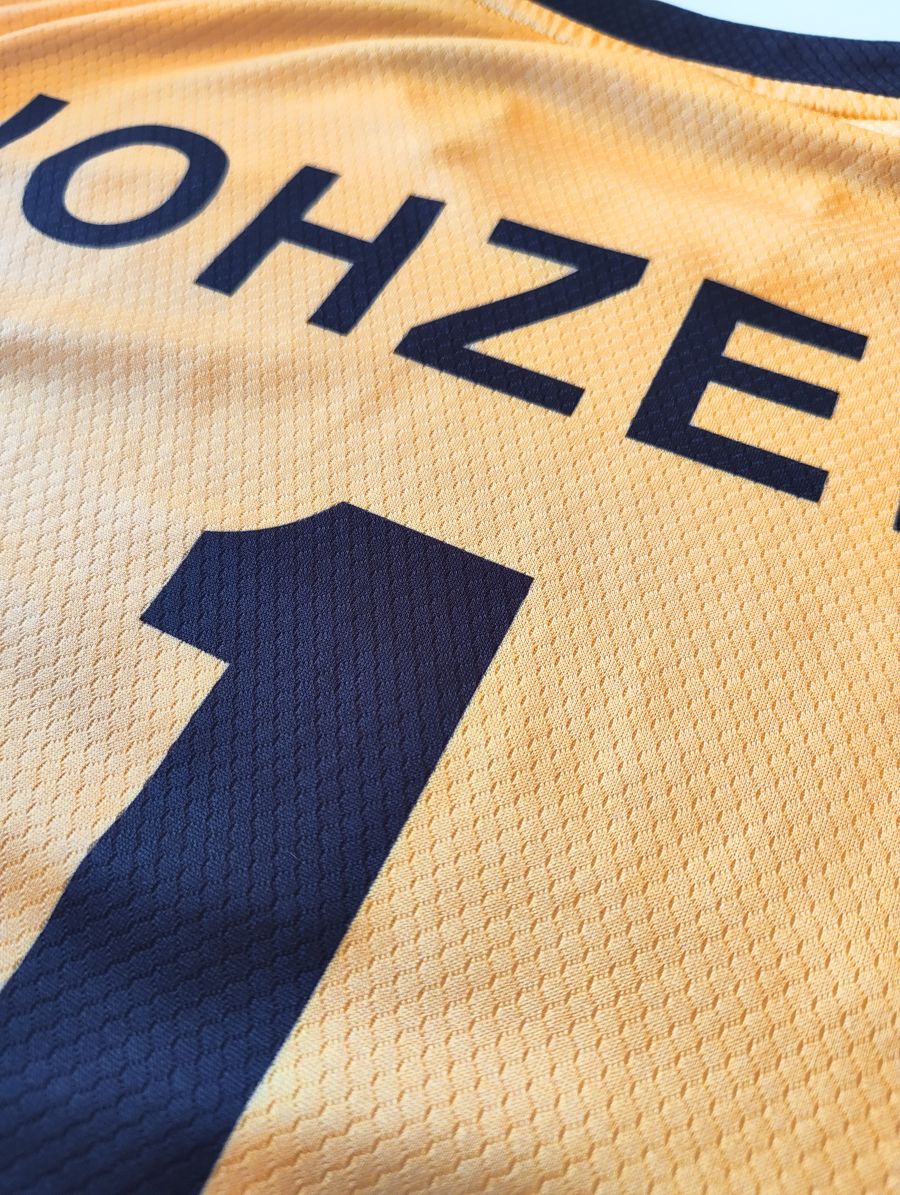 Close-up: Team name across the back